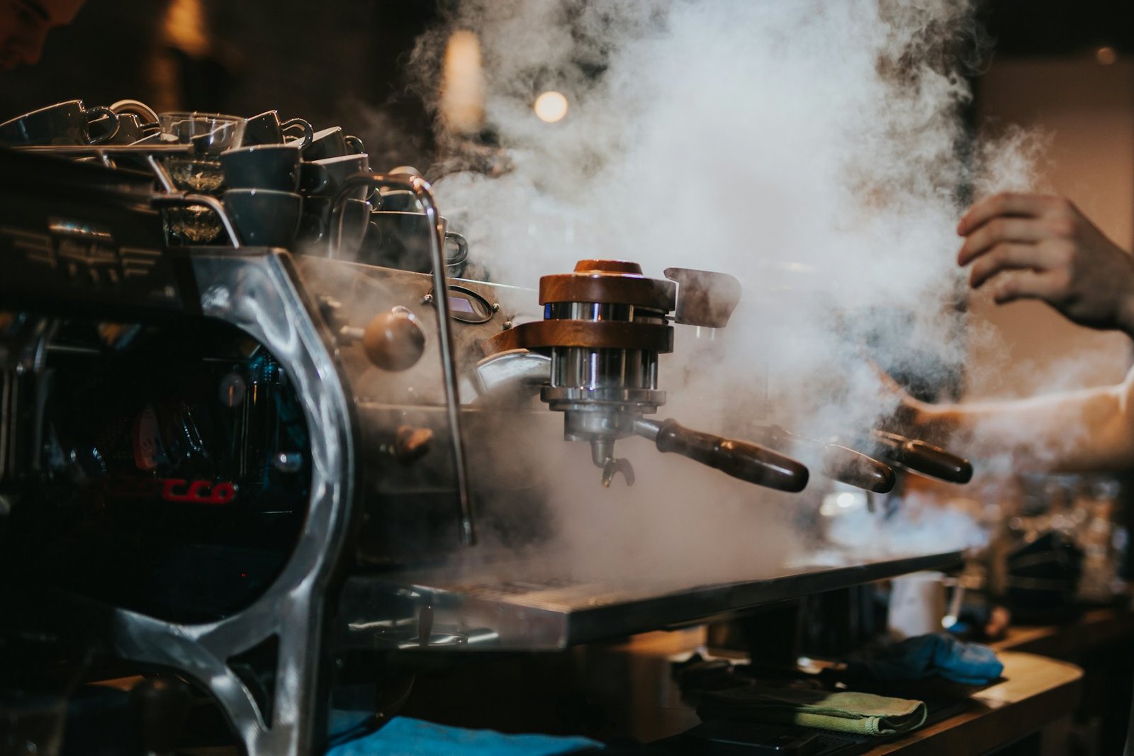 Steam rising from a busy espresso machine