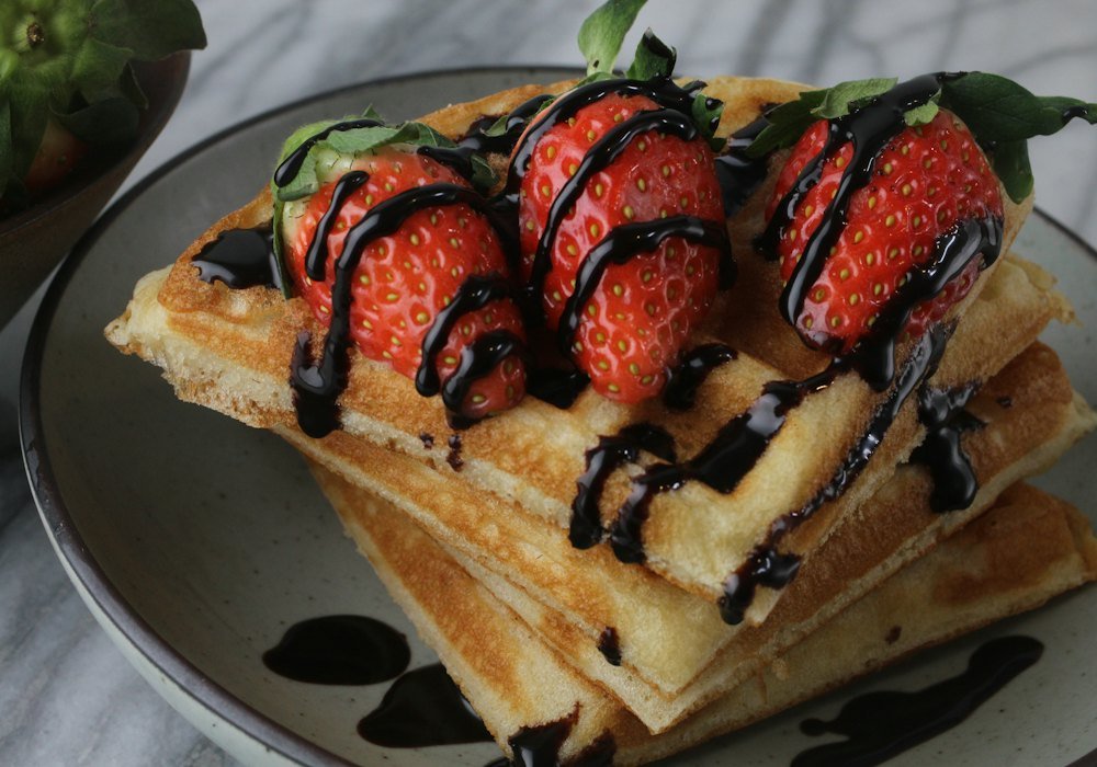 Waffles with strawberries and chocolate