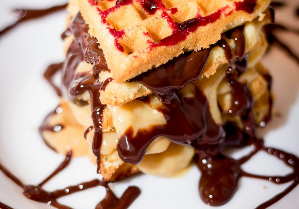 Stacked waffles with chocolate drizzle